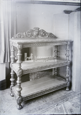 Ornate hardwood , gilded 3-shelf table