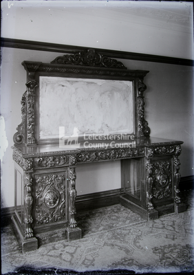 Ornate hardwood dresser with mirror