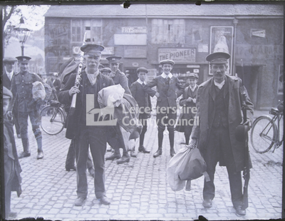 Reserve soldiers with bags and rifles, leaving magazine barracks	