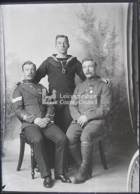 3 soldiers/sailors posing in studio