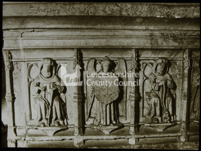 Three figures on the side of the tomb of Richard Neel.	