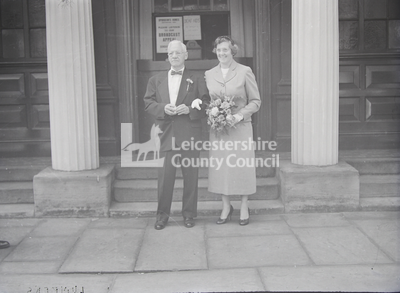 Dr Williams and wife in formal wear;
