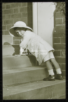 Boy kneeling on steps