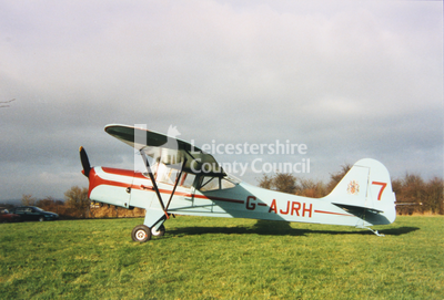 Auster aircraft on grass, registration G-AJRH