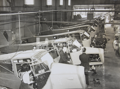 Factory Interior with aircraft and workers