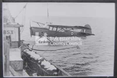 Auster aircraft in waters next to Antarctic vessel