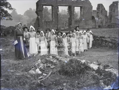 Group Of Children Wearing Mediaeval Costumes In Bradgate Park Ruins