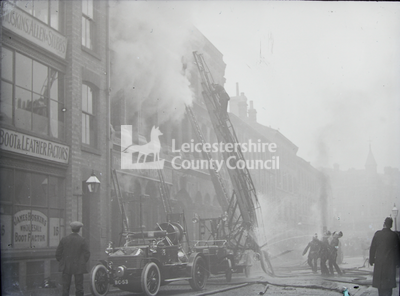 Fire engine and large crane extended