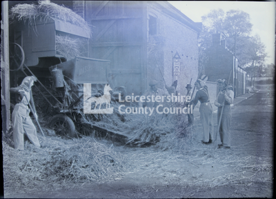 Land Army Girls, at rear of threshing machine, Trowlesworth