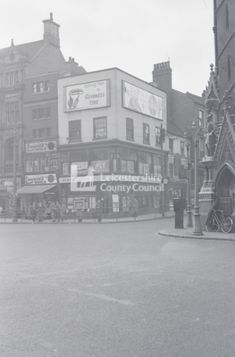 Street corner adverts for Guinness and Coke		