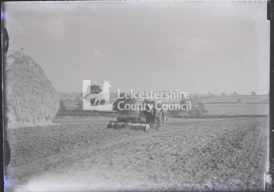 Tractor And Disc-Harrow In Ploughed Field
