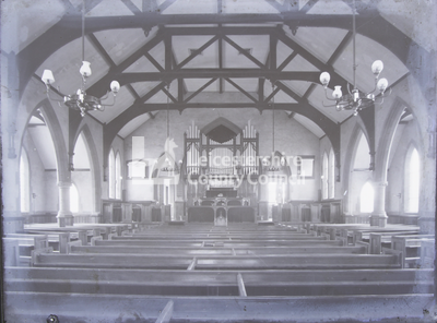 Interior of church looking toward pulpit and organ
