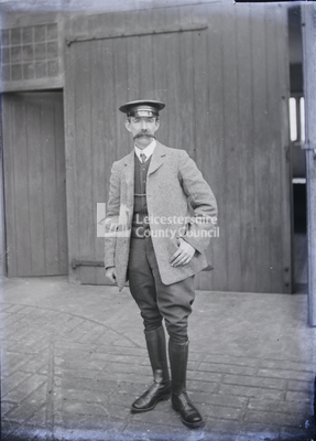 Military Dress: Man standing in courtyard