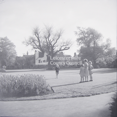 Westcotes Gardens: 4 girls standing on lawn