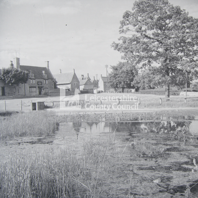 Barrowden -  View across pond to village street 