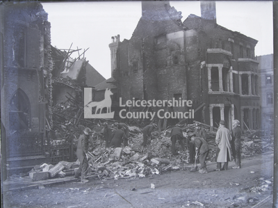 Leicester: Cleanup crew in bombed gap between buildings