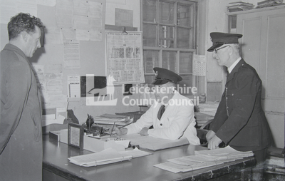 Prison guards at their desk