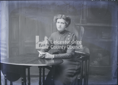 Portrait of woman sitting at desk