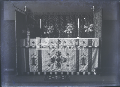 Altar, with cloth and flowers