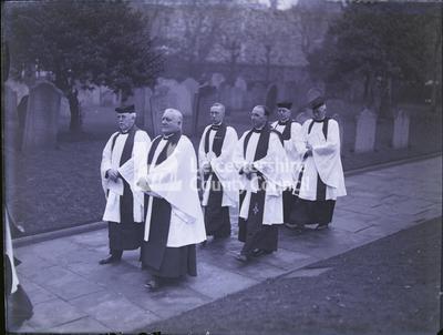 Procession through Cathedral churchyard with six clergy