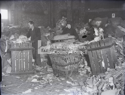 Waste Paper Salvage: men and woman sorting paper in crates