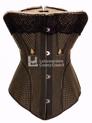 Black front busk corset, 1875