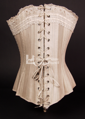 Corset with hand stitched detail, 1885: Back view