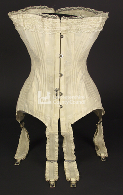 Cream corset with frilled suspenders, 1905