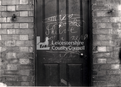 L2456 - Graffiti on the door of a house in Charlotte Street, Leicester